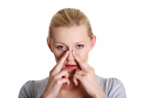 woman suffering from nasal congestion