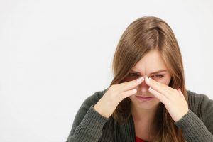 woman suffering from sinus pain