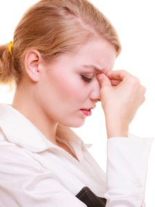 woman suffering from sinus pain