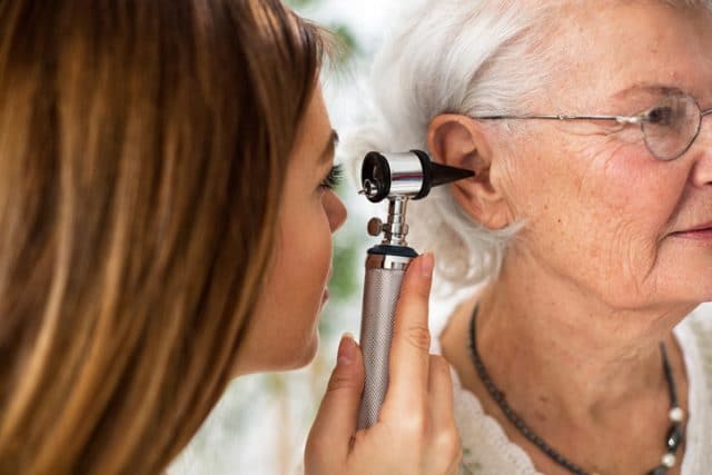 woman getting hearing test e1551123388819