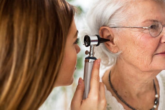 woman getting hearing test e1551123388819