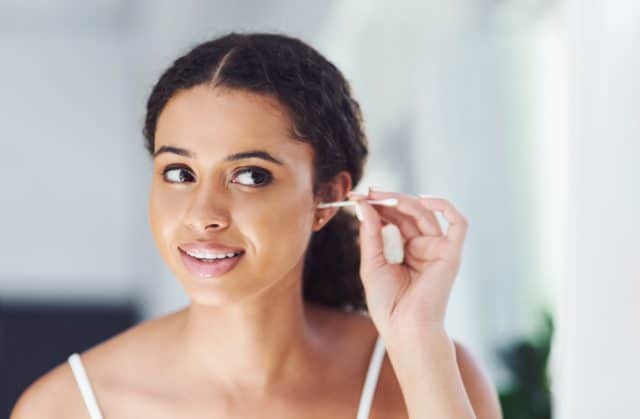 woman cleaning ear