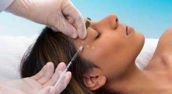 mixed race woman receiving botox injection picture id512629537 350x192 1