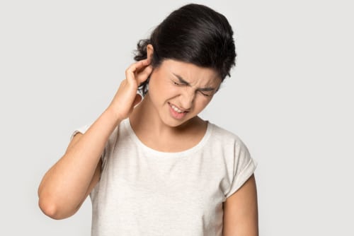 Unhealthy indian millennial lady suffering from strong earache