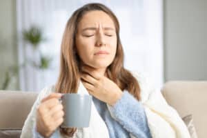Young,Woman,Touching,Painful,Neck,,Sore,Throat,For,Flu,,Cold